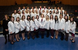 Dr. Linda Hensman (left), dean of Memorial's School of Pharmacy, stands with the class of 2016.