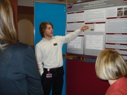 3rd year undergraduate student Nelson Pearce explains his research at the 2013 School of Pharmacy research poster competition