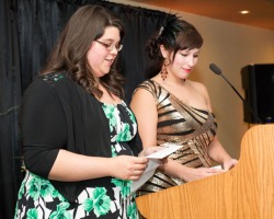 Class of 2013 Graduation Committee, co-chairs, Samantha Kent (left) and Melissa Jacobs address the guests at the School of Pharmacy Graduation Dinner on May 31.