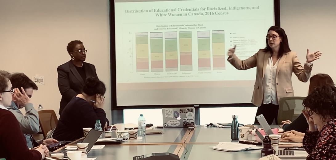 A professor presenting data to students.