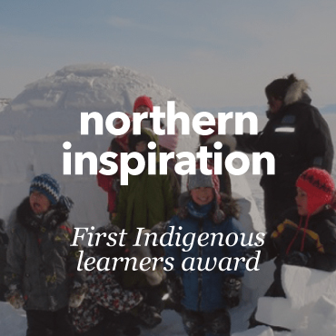 A group of Indigenous people standing in front an igloo.