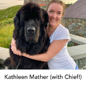 Kathleen Mather hugs a big Newfoundland dog at Signal Hill. 