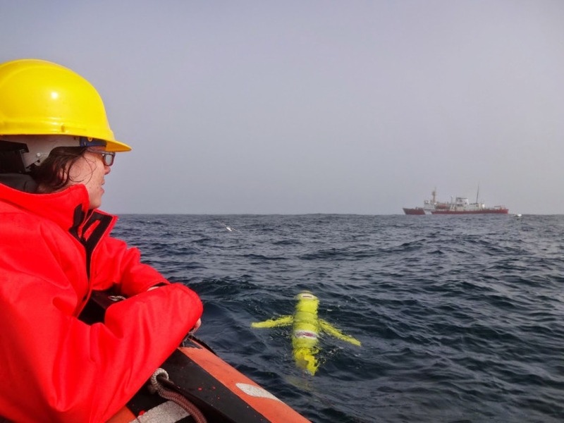 Tara Howatt looks on as a glider from Memorial University is deployed on the Newfoundland shelf with the CSS Hudson in the background in July 2014.

