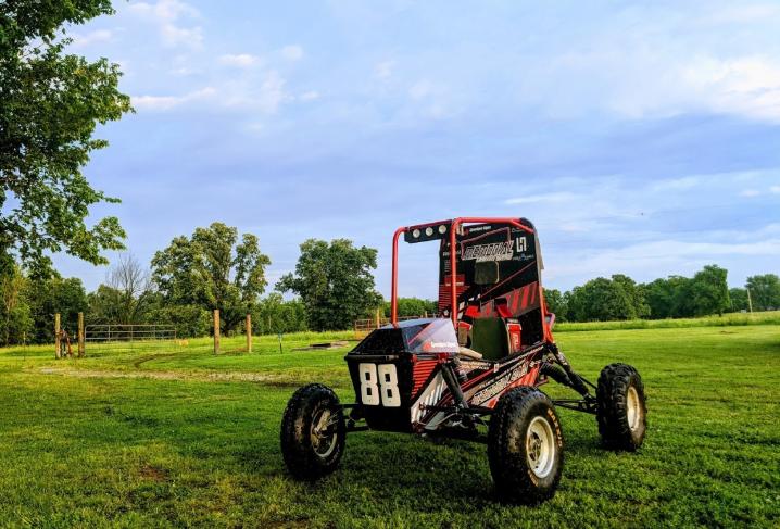 A photo of Memorial's Baja car on a grass field